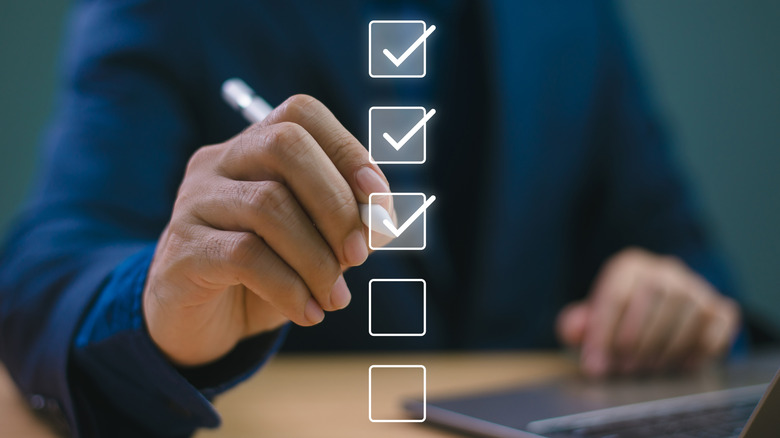 Graphic of person using checkboxes