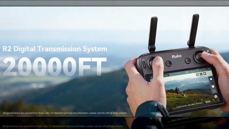 A man using the drone's controller in mountainous terrain.