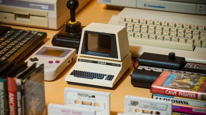 Old tech and gaming gear on a desktop.