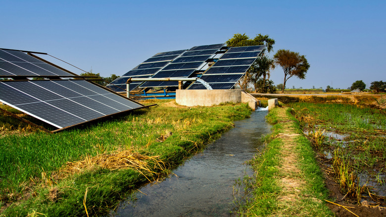 A solar pump connected to a water channel for irrigation in a field