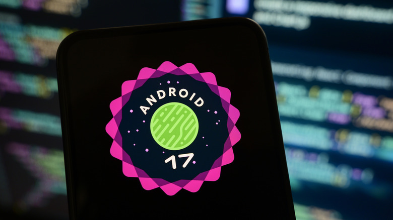 A phone displaying the logo for Android 17