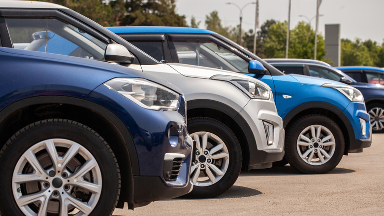 Cars are on display at a dealership.