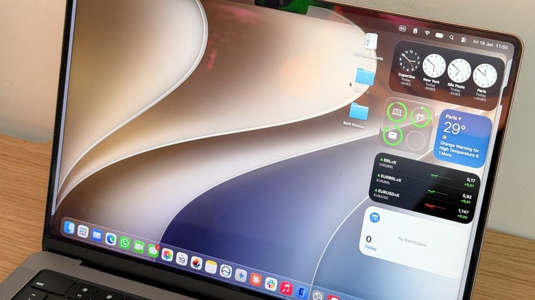 A close-up shot of a MacBook Pro running macOS Golden Gate
