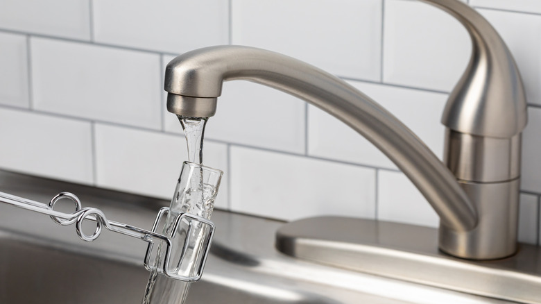 Tap water being sampled for contaminants