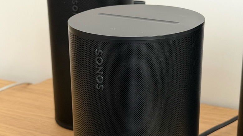 Sonos Era 100 SL speaker on a table