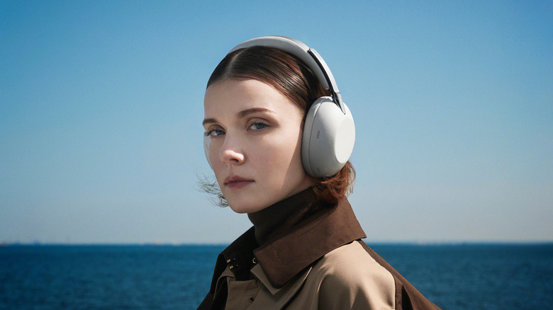 A woman wearing the Sony 1000X The Collexion headphones
