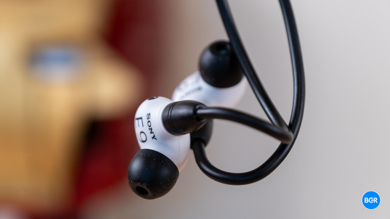 Sony Inzone E9 earbuds hanging in the air