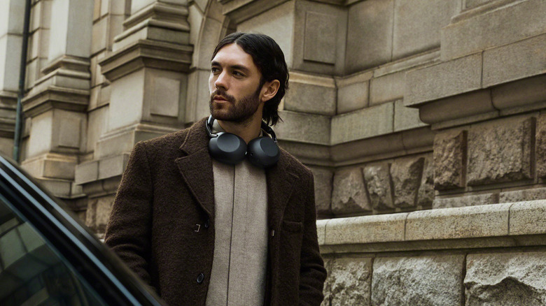 Man wearing the Sony 1000X The ColleXion headphones