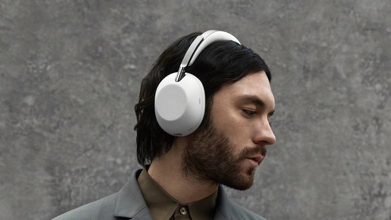 Man wearing the Sony 1000X The ColleXion headphones