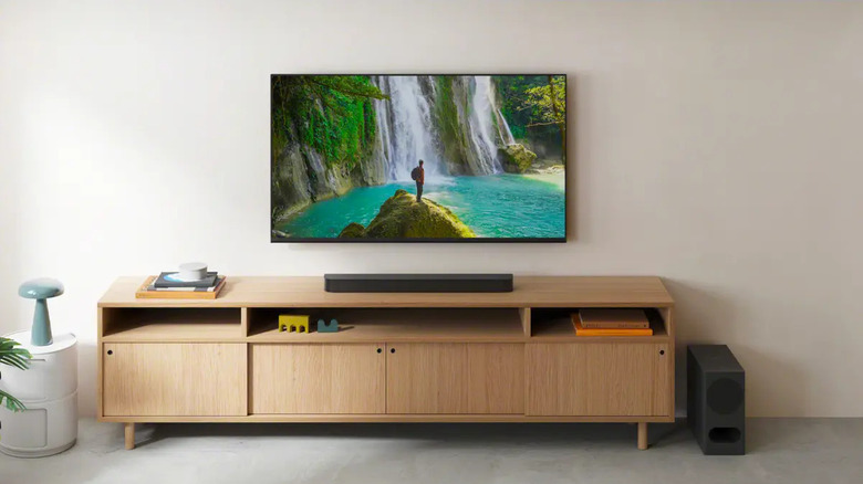 The Sony Bravia Theater Bar 5 set up on an entertainment center below a wall-mounted TV.