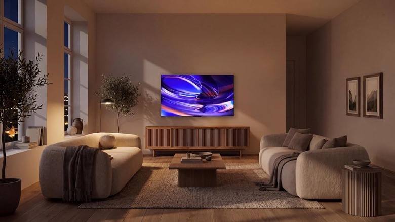 Sony Bravia 6 Series OLED TV installed on a wall in a modern living room.
