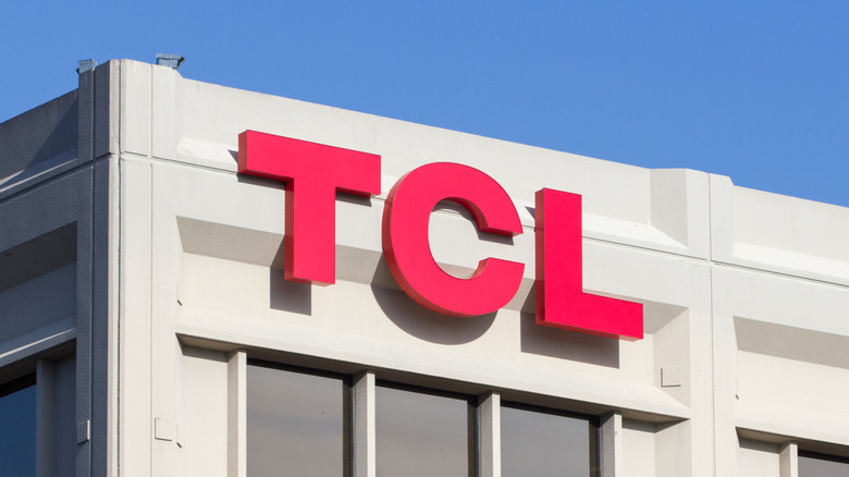 The TCL logo as it appears on its American campus, the TCL logo is red and appears on the corner exterior of a building