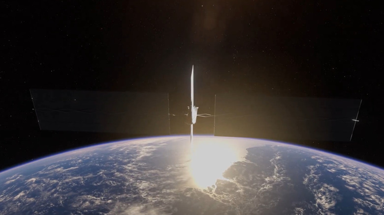 A 3D rendering of SpaceX's AI1 Satellite in space, with the satellite passing over an orbital sunset