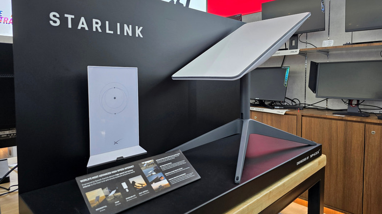 Starlink display with satellite in a retail store.