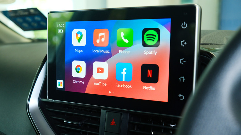 An infotainment screen showing the Spotify logo along with several other apps