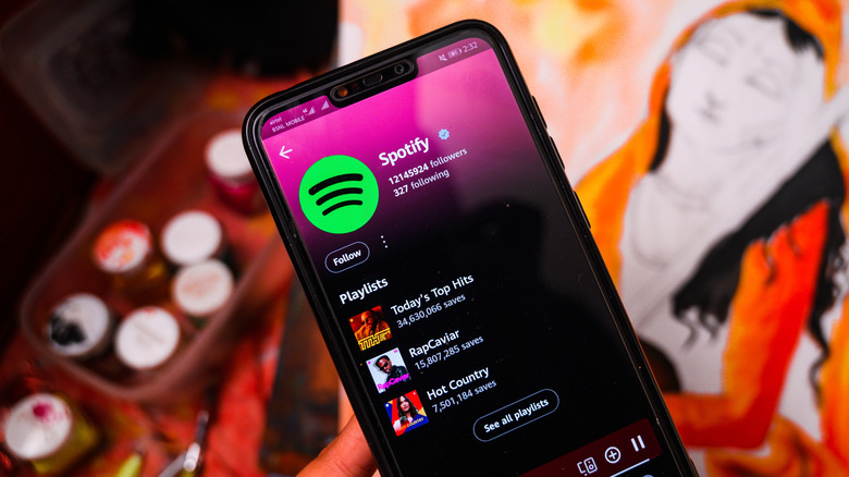 person with spotify pulled up on their smartphone