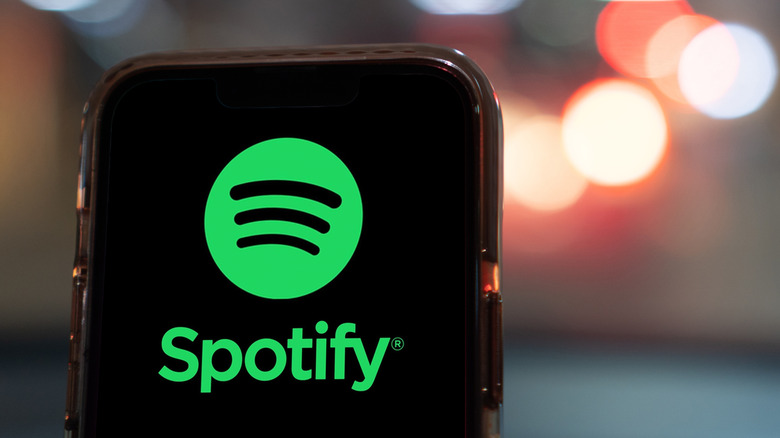 spotify logo on a smartphone, blurred background