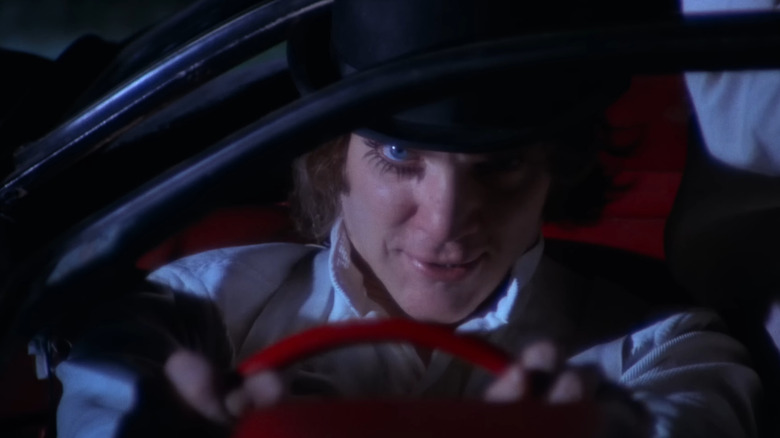 Malcolm McDowell as Alex in A Clockwork Orange, driving a car