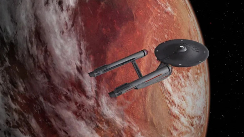 View of the Enterprise from above as it orbits a planet, showing location of bridge