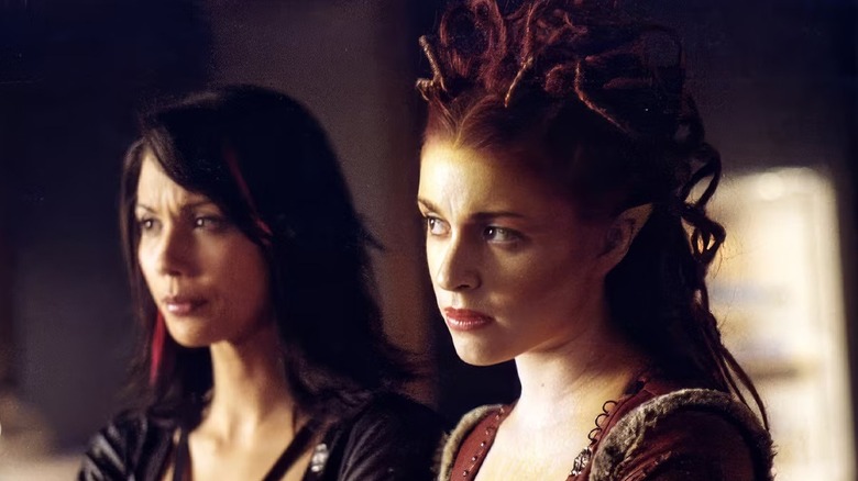 Rommie (Lexa Doig) and Trance (Laura Bertram) standing next to each other on "Andromeda."