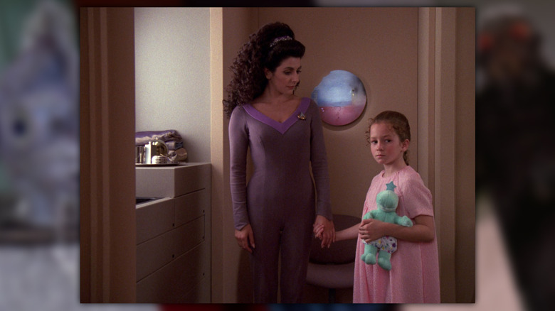 Deanna Troi and a child
