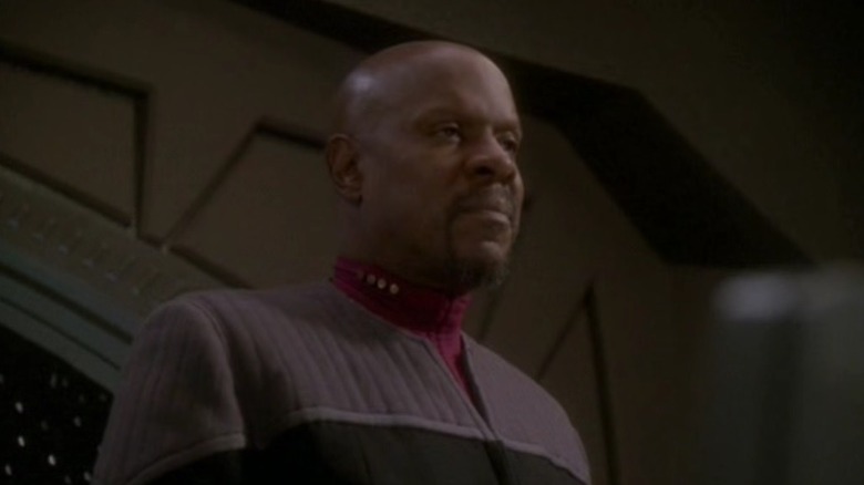 Captain Sisko standing and glaring
