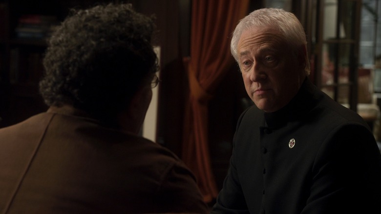 Brother Adrian (Brent Spiner) looking at Artie (Saul Rubinek) on "Warehouse 13."