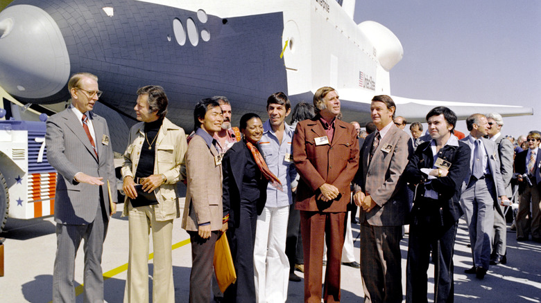Space shuttle Enterprise together with the Gene Roddenberry and the cast members of Star Trek