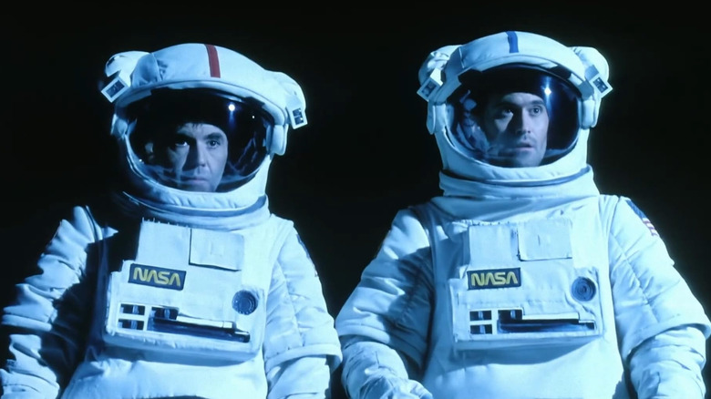 Walter Koenig and Bruce Campbell wearing spacesuits in Moontrap