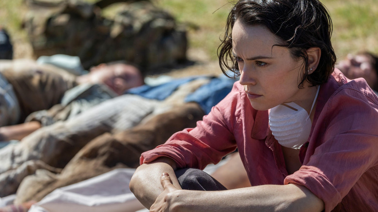 Ava Newman sitting next to dead bodies