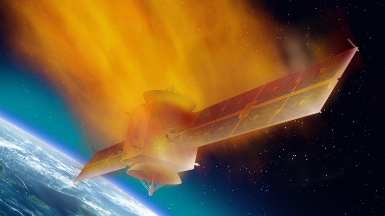 Concept art of a satellite burning up as it falls from orbit to Earth