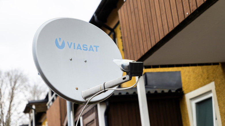a Viasat satellite dish outside a building