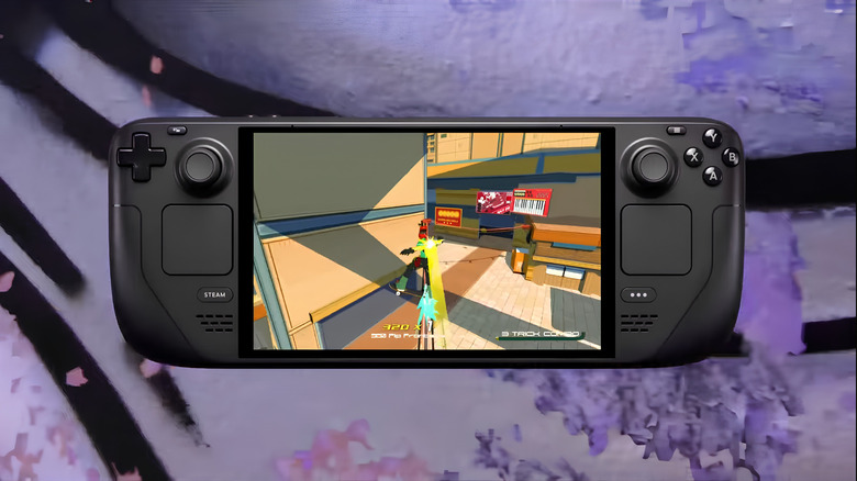 Steam Deck OLED showing off it's OLED screen on a spray painted wall background