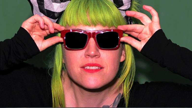 Woman wearing sunglasses that block facial recognition technology