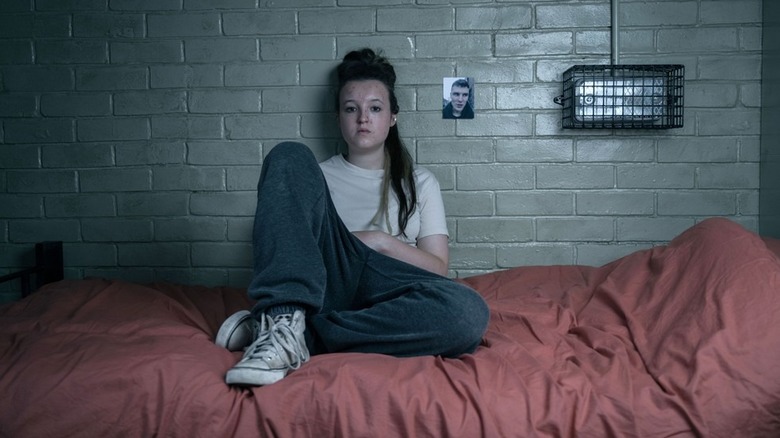 Kelsey sitting on the bed in her cell in "Time" season 2