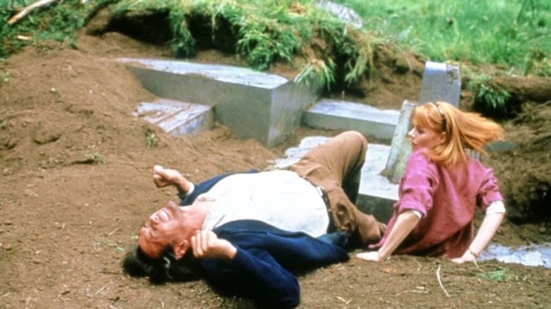 Jim Gard convulsing on the ground next to Bobbi Anderson