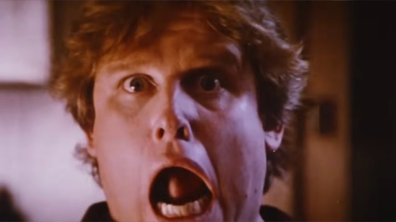 Gary Busey as Uncle Red in Silver Bullet with his mouth agape.