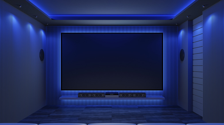 A modern home theater with blue mood lighting.