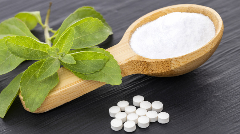 An image of stevia shown as plant, powder, and pill