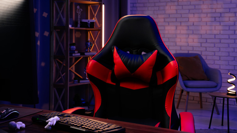 A PC setup highlighting a black and red gaming chair