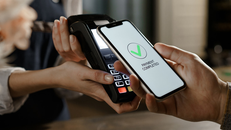 A customer completing a purchase via digital payment