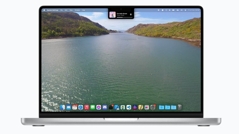 A MacBook Pro mockup displaying MediaMate in action