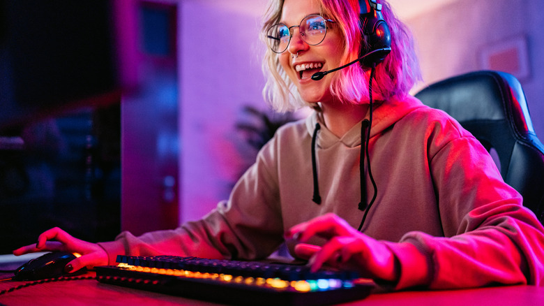 A woman gaming on a PC