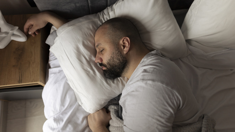 A man sleeping on his side