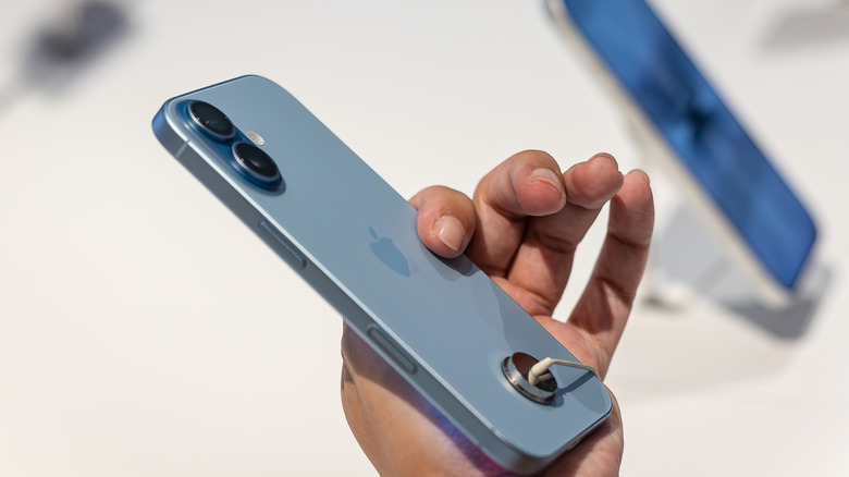 The iPhone 17 in blue held in the hand