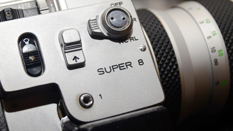 The side of a Super 8 film camera.