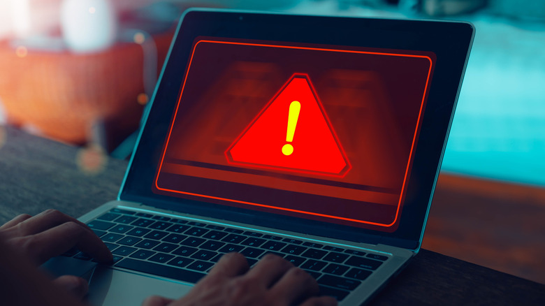 Artistic rendition of a cyberattack on a laptop
