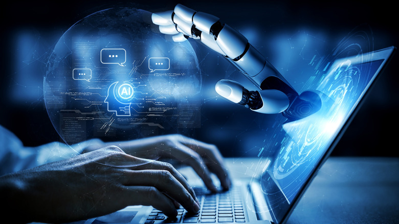 An abstract image of AI with a robotic hand reaching through a laptop display