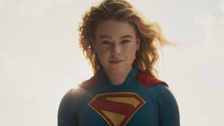 Milly Alcock as Supergirl smiling in 
