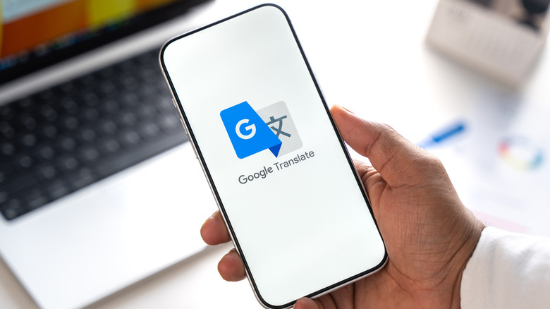 The Google Translate logo on a smartphone screen